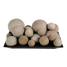 a pile of rocks sitting on top of a black tray