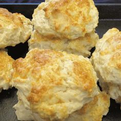 biscuits are piled on top of each other in a baking pan, ready to be eaten