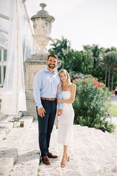 a man and woman standing next to each other