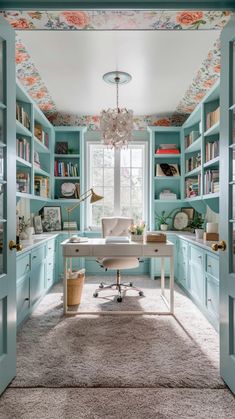 a home office with blue bookcases and flowers on the ceiling, along with a rug