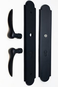 two black handles are next to each other on a white surface and one is open