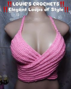 there is a mannequin wearing a pink top with crochets on it