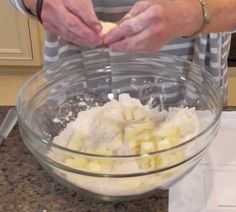 someone is mixing ingredients in a bowl on the counter