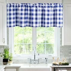 a blue and white checkered kitchen window curtain