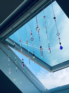 there is a skylight that has beads hanging from it