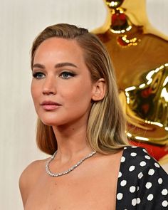 a close up of a person wearing a polka dot dress