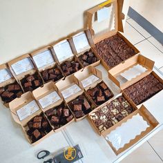 there are many different boxes of chocolates on the floor next to each other and scissors