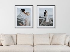 two framed pictures hang on the wall above a couch in front of a white sofa