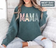 "Comfort Colors® Blessed Mama Sweatshirt,  Cute Mom Sweatshirt, Mother Tee, Cute Mom Sweat, Cute Mom Gift, Mothers Day Gift, New Mom Gift Hi! WELCOME TO DELUXSTOREUSA This sweatshirt perfect gift as a holiday apparel. Ideal for any situation, a unisex heavy blend crewneck sweatshirt is pure comfort  Washing Care Instructors Use cold water when washing, do not use bleach, do not dry clean, and do not use an iron directly on the design.  Production Time Production time is 1-2 days. Delivery time varies depending on your delivery address. How to Order?   Please, choose your favorite color and size from the pop-up window.  Select the quantity that you want.  Click \"ADD TO CART\".  You can go back to add more product color for your loved ones members.  You can complete the checkout process.  P Long Sleeve Tops For Mother's Day Loungewear, Crew Neck Top For Mother's Day Loungewear, Crew Neck Top For Loungewear On Mother's Day, Crew Neck Top For Loungewear, Casual Tops For Mother's Day Loungewear, Green Long Sleeve Tops For Mother's Day, Soft-washed Crew Neck Tops For Mother's Day, Blessed Mama, Holiday Apparel