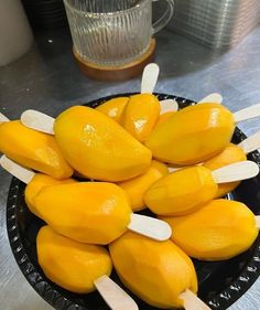 a bowl filled with lemons on top of a table