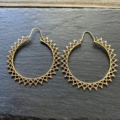 Step into the world of timeless elegance with our Handcrafted Mandala Hoop Brass Earrings - a mesmerizing blend of artistic flair and bohemian charm. Meticulously crafted in brass, these earrings feature intricate mandala designs that add a touch of spirituality and style to your ensemble. Material: High Quality Brass  Width - 2 1/4 inches (5.71cm) Length - 2.5 inches (6.35cm) LIGHTWEIGHT  🌟 **Key Features - **Artisanal Craftsmanship Each pair is meticulously handcrafted, ensuring a unique and Spiritual Style, Intricate Mandala, Mandala Earrings, Mandala Designs, Circular Pattern, Handmade Brass, Ethnic Style, Mandala Pattern, Brass Jewelry