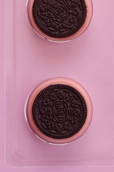 two oreo cookies sitting on top of each other