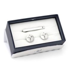 A Christian cross appliqué sits atop a polished circle base on these stainless steel cufflinks, turning a simple design into a classic look you'll want to wear again and again. We've paired them with our bestselling coordinating tie clip, featuring an elegant cross cutout, to create the perfect gift set. Includes branded gift box. Classic Stainless Steel Business Jewelry, Modern Cross Jewelry For Formal Occasions, Modern Jewelry With Gift Box, Cross Applique, Christian Cross, Tie Clip, Classic Looks, Simple Designs, Cufflinks