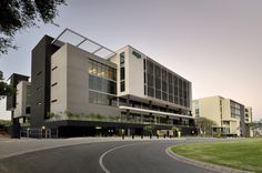 an empty street in front of a large building