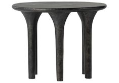 an iron table with two legs and a black top