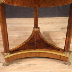 a wooden table sitting on top of a hard wood floor