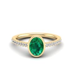 This exquisite ring features a stunning oval emerald stone surrounded by sparkling diamonds, creating a timeless and elegant piece of jewelry. The emerald's rich green hue is complemented by the brilliance of the diamonds, making it a perfect choice for special occasions or as a luxurious everyday accessory. Metal: 14K Gold Setting Type: Prong Rhodium Finish: Yes, on White Gold Gemstone Details: Gemstone: Emerald Shape: Oval Average Dimensions: 8.00 x 6.00 MM Quantity: 01 Average Cut: Very Good Oval Emerald Ring With Pave Setting For Formal Occasions, Oval Tsavorite Diamond Ring For Formal Occasions, Oval Emerald Ring With Pave Diamond Setting, Oval Emerald Ring With Diamond Pave Setting, Brilliant Cut Oval Diamond Ring With Tsavorite, Classic Oval Tsavorite Emerald Ring, Green Oval Diamond Ring Fine Jewelry, Oval Tsavorite Diamond Ring In Green, Oval Emerald Rings With Pave Setting