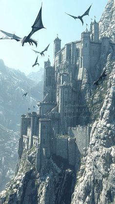 an image of a castle with flying birds in the sky above it and mountains behind it