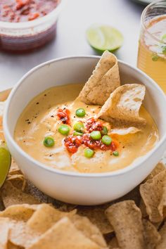 a bowl of quesadilla soup with tortilla chips on the side