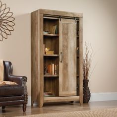 a living room with a chair and bookcase