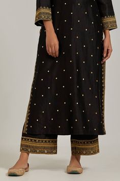 Black chanderi silk kurta with sequin, floral embroidery and V neckline. Paired with pant.
Component: 2
Pattern: Embroidery
Type Of Work: Floral, sequin
Neckline: V neck
Sleeve Type: Long sleeves
Fabric: Chanderi Silk
Color: Black
Other Details: 
Note: Dupatta worn by the model is not for sale
Occasion: Sangeet - Aza Fashions Tussar Silk Palazzo Set For Festivals, Chanderi Palazzo Set With Resham Embroidery For Diwali, Unstitched Palazzo Set With Zari Work In Raw Silk, Festive Tussar Silk Palazzo Set With Cutdana, Festive Palazzo Set With Cutdana In Tussar Silk, Festival Semi-stitched Tussar Silk Palazzo Set, Festive Tussar Silk Palazzo Set For Eid, Eid Festive Tussar Silk Palazzo Set, Bollywood Style Tussar Silk Set For Festive Occasions