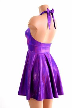 "This item is made to order, please read all the way through the listing before purchasing! This flowy dress is made of beautiful grape purple holographic spandex. The halter top is darted and ties behind the neck, the hemline is circle cut. Length: 17\" measured from the waist to the hemline. We can create this dress from any other fabric in our shop, just ask! Womens Sizing (See below for instructions on where measurements should be taken) XXS: Bust 29\"-30\" / Waist 22\"-23\" / Hips 30\"-32\" Fitted Iridescent Mini Dress For Spring, Spring Fitted Iridescent Mini Dress, Spring Iridescent Fitted Mini Dress, Iridescent Fitted Mini Dress For Party, Fitted Rave Party Dresses, Iridescent Fitted Spring Dress, Shiny Fitted Backless Dress, Iridescent Fitted Mini Dress, Fitted Shiny Backless Dress