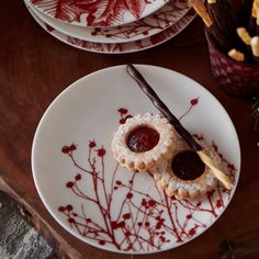 a plate with some desserts on it sitting on a table next to other plates