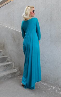 "New women draped dress with pleated shoulder. Long bridesmaid pintuck dress in a deep blue-green color that matches so perfectly the ocean. The extra soft fabric makes it comfortable to wear even in those rough dog days. Material: 95% viscose, 5% elastane Care instructions: Wash at 30 degrees. The model in the picture is size S. Can be made in ALL SIZES. If you have any other specific requirements, do not hesitate to contact me! I DO NOT CHARGE EXTRA MONEY for custom made items. All you need to Pre-draped Maxi Dress With Folds, Pleated Draped Maxi Dress For Wedding, Draped Pleated Maxi Dress For Wedding, Pleated Pre-draped Floor-length Maxi Dress, Flowy Draped Ruched Maxi Dress, Billowy Ruched Maxi Dress For Parties, Flowy Draped Ruched Dress, Draped Dresses With Pleated Bodice For Bridesmaids, Bridesmaid Dress With Pleated Bodice And Draped Shape