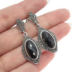 Great vintage condition.  925 Sterling Silver Vintage Real Black Spinel & Marcasite Gem Dangle Earrings  Weight: 10.2g   WELCOME TO PAWN SHOP We are an actual pawn shop and have been in business for over 25 years. Since 1990, our establishment has been serving a variety of clients by providing them with short term cash solutions and options of liquidity regarding their treasured heirlooms. Acknowledging that today′s customers are very sophisticated and are looking for a variety of investments, o Vintage Black Sterling Silver Earrings, Silver Marcasite Jewelry With Gemstone, Vintage Marcasite Jewelry, Silver Faceted Black Spinel Jewelry, Marcasite Earrings, Black Spinel, Etsy Earrings Dangle, Vintage Jewelry, Jewelry Earrings Dangle