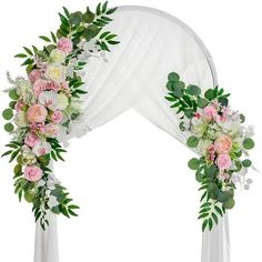 a wedding arch decorated with flowers and greenery