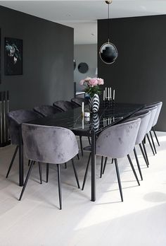 a dining room table with chairs around it