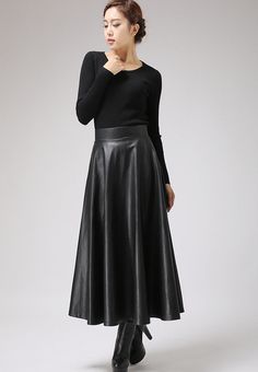 "This faux leather skirt is a timeless piece that goes with everything . This PU vegan skirt looks good away and can dress up or down with swift change of top and shoes. This maxi skirt should be your new wardrobe staple DETAIL * Soft black PU fabric * Vegan fabric * Polyester lining * Back zip closure * Two seam pockets * Midi calf Length * Suit for Autumn, winter and spring SIZE GUIDE Size vary between Brand and Country Please get your body measurement with our Size Guide And Find your size in Relaxed Flared Leather Skirt, Elegant Faux Leather Midi Skirt, Leather Flared Skirt For Fall, Fall Leather Flared Skirt, Winter Leather Midi Skirt, Faux Leather Evening Skirt For Fall, Spring Leather Long Skirt, Fall Evening Faux Leather Skirt, Elegant Faux Leather Pleated Skirt