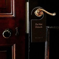 a door with a do not disturb sign on it