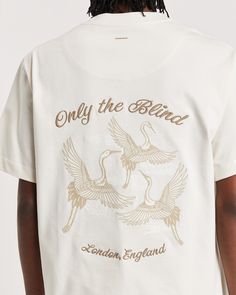 Tailored in a signature luxurious cotton, this t-shirt in a light beige features a beige tonal embroidered crane artwork across the back in beige with 3D raised embroidery text complimenting a chest embroidery. Crafted with refined quality and care from OEKO-TEX® tested fabrics and specialist embroidery threads of the highest quality to achieve the unique look and feel, this is crafted luxury at its best in a relaxed fit. T Shirt With Embroidery, Embroidery Tee Shirts, T Shirt Artwork, Brand T Shirt Design, Crane Artwork, Embroidery Tshirts, Luxury T Shirt, Embroidery Text, T Shirt Embroidery