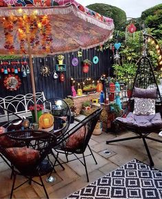 an outdoor patio with lots of furniture and decorations