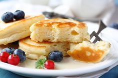 pancakes with blueberries and raspberries on a plate