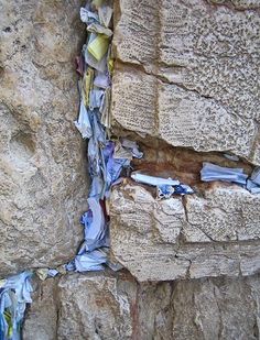 the wall is covered with newspaper and other items