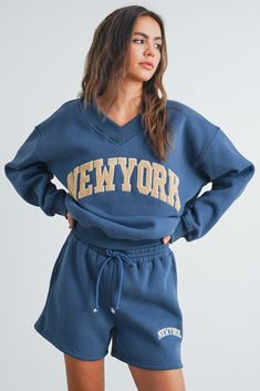 Step up your casual game with our New York Embroidered Sweat Shorts. Made with soft, high-quality fabric for all-day comfort, these shorts also offer a relaxed fit and can be paired with our matching sweatshirt for a complete look. Comfort and style, all in one! Teen Hoodies, V Neck Sweatshirt, Cute Sweats, Teddy Hoodie, Fall Apparel, Comfy Sweats, Drawstring Waist Shorts, Sweat Set, Matching Sweatshirts