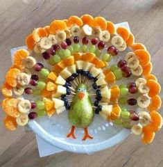 a turkey made out of fruit on a plate