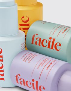 three different types of face lotion bottles on a white surface with the words facile printed on them