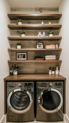 a washer and dryer in a room with shelves on the wall above them