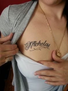 a woman with a name tattoo on her chest