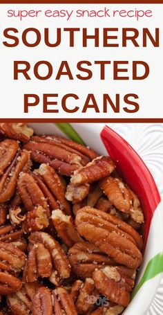 a white bowl filled with roasted pecans on top of a green and white plate