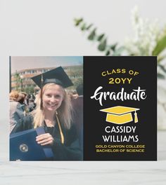 a graduation card with the graduate's name on it and flowers in the background