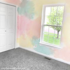 an empty room painted in pastel colors