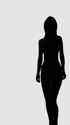 the silhouette of a woman is shown in black and white