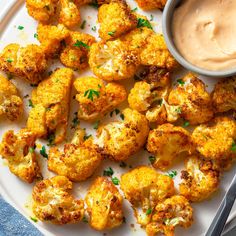 cauliflower on a plate with dipping sauce