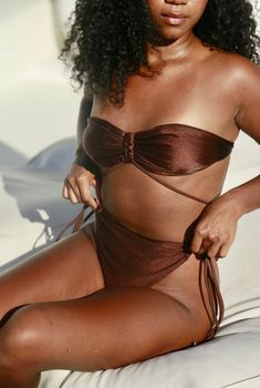 Description: Luxury swimwear produced in Bali, Indonesia designed for Boss Babes. Butter Swimwear offers high-quality swimwear that accentuates curves and empowers women to feel confident in their skin! Each piece is named after a unique travel destination. This string bikini top is adjustable to your desired fit and can be styled in more than one way. It pairs perfectly with the Jakarta bikini bottoms. Size & Fit: Model is wearing a size medium Details: 80% Nylon, 20% Spandex Hand Wash Only, La Unique Travel, Luxury Swimwear, Boss Babe, Feel Confident, Jakarta, Women Empowerment, String Bikinis, Espresso, Bali