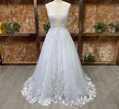 a - line v - neck tulle appliques sweep train wedding dress