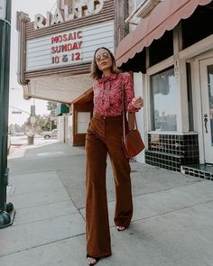 Brown corduroy flair pants styled with a red floral blouse by Emily Vartanian #style #ootd #outfits #falloutfits Brown Pants Outfit, Flair Pants, Red Floral Blouse, Brown Corduroy Pants, Wide Wale Corduroy, Outfits 70s, Mode Hippie, Fashion For Petite Women